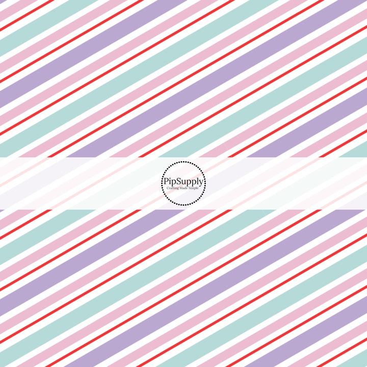 These winter stripe themed pattern fabric by the yard features the following design elements: Christmas pastel diagonal stripes. This fun themed fabric can be used for all your sewing and crafting needs!