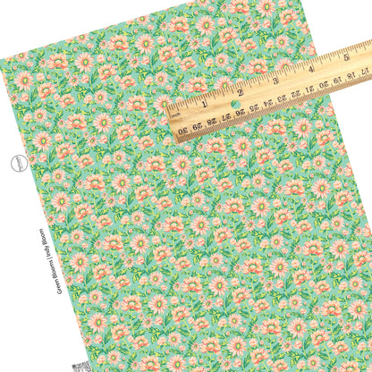 These pastel watercolor blooms on green faux leather sheets contain the following design elements: light pink, peach, and light green beautiful flowers and leaves.