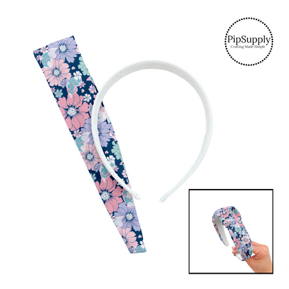 Pastel flowers in pink, aqua, purple, and white with aqua butterflies on dark navy blue DIY knotted headband kit.