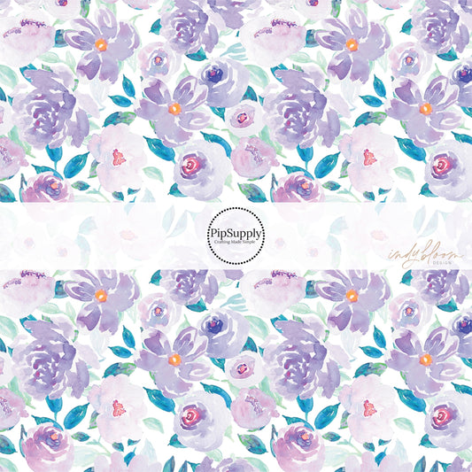 These pastel watercolor flowers on white fabric by the yard features light blue, teal, purple, and lavender flowers and leaves. 