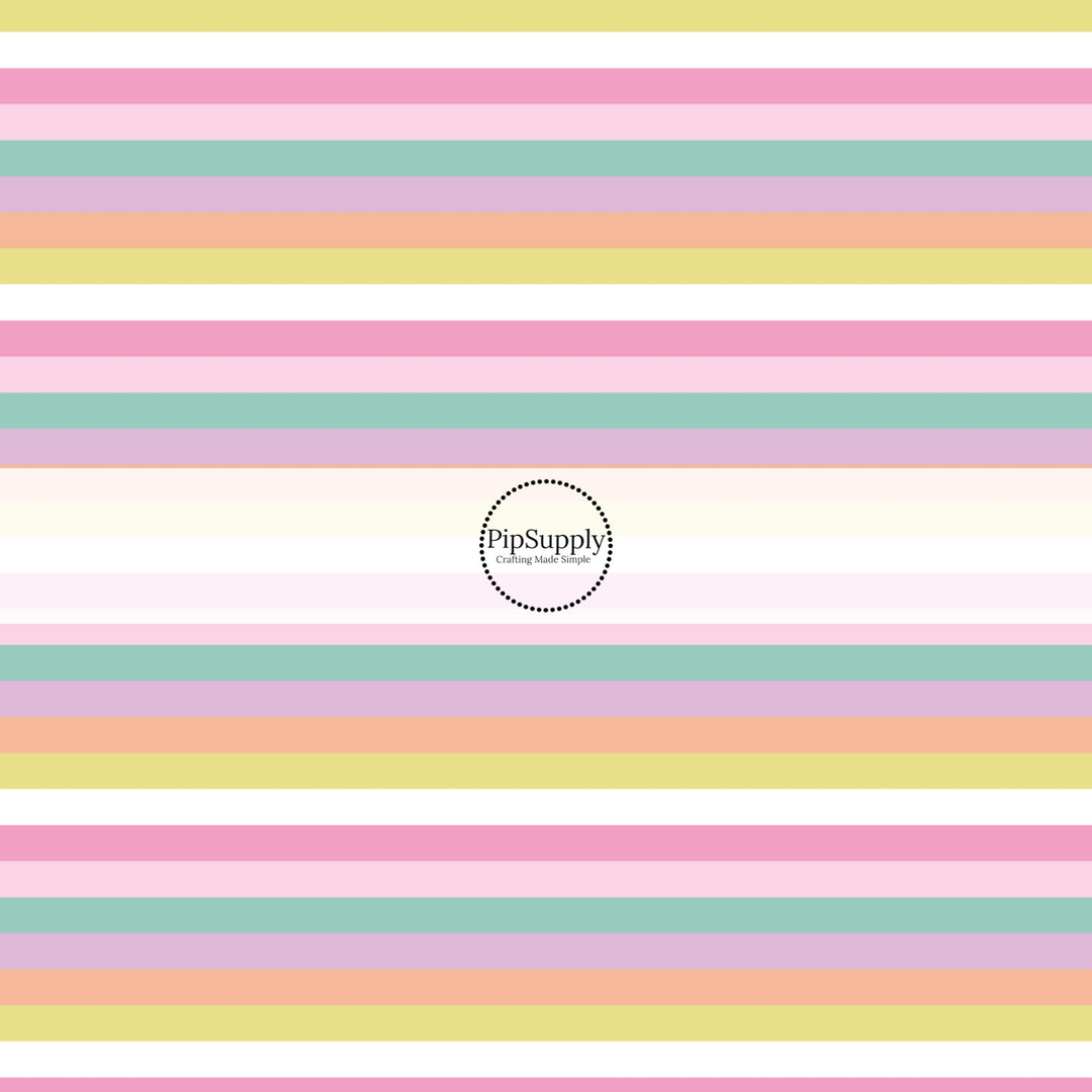 This holiday fabric by the yard features pastel rainbow stripes. This festive pattern fabric can be used for all your sewing and crafting needs!