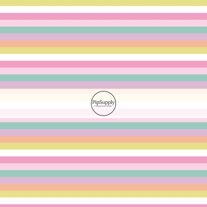 This holiday fabric by the yard features pastel rainbow stripes. This festive pattern fabric can be used for all your sewing and crafting needs!