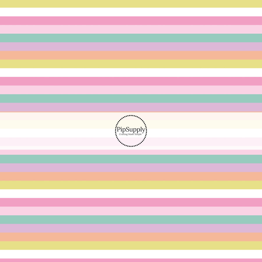 This holiday fabric by the yard features pastel rainbow stripes. This festive pattern fabric can be used for all your sewing and crafting needs!