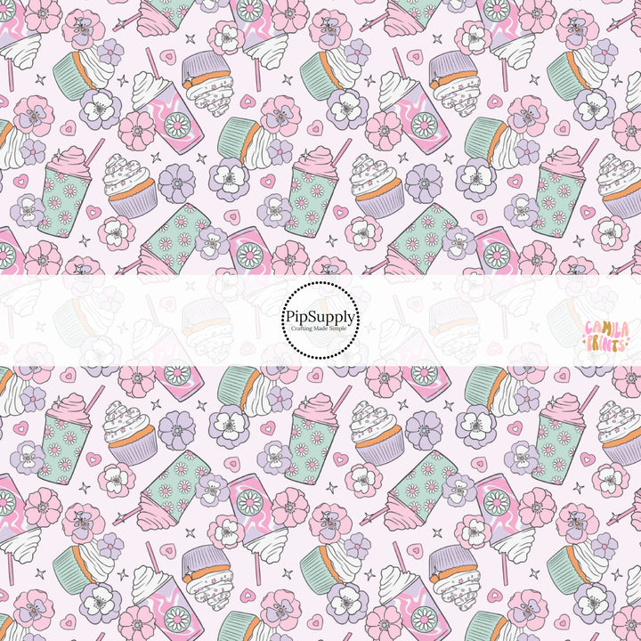 This spring themed fabric by the yard features pastel flowers, drinks, and desserts. This fun pattern fabric can be used for all your sewing and crafting needs!