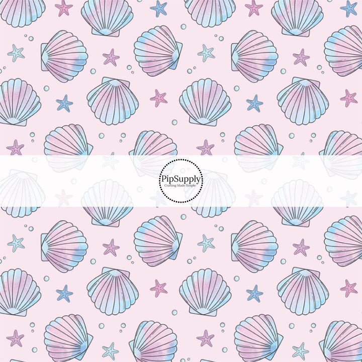 This pastel fabric by the yard features watercolor pink and purple sea shells. This fun summer themed fabric can be used for all your sewing and crafting needs!