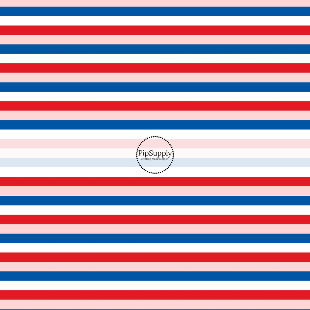 These patriotic fabric by the yard features blue, pink, and red stripes. This fun pattern fabric can be used for all your sewing and crafting needs!