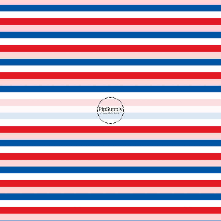 These patriotic fabric by the yard features blue, pink, and red stripes. This fun pattern fabric can be used for all your sewing and crafting needs!