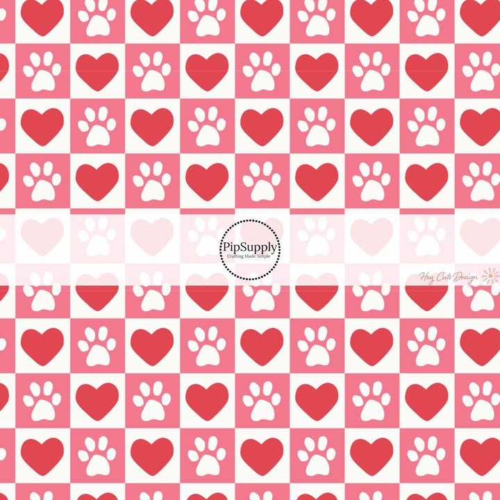 This holiday fabric by the yard features red hearts and dog paws on pink and cream checkers. This festive pattern fabric can be used for all your sewing and crafting needs!