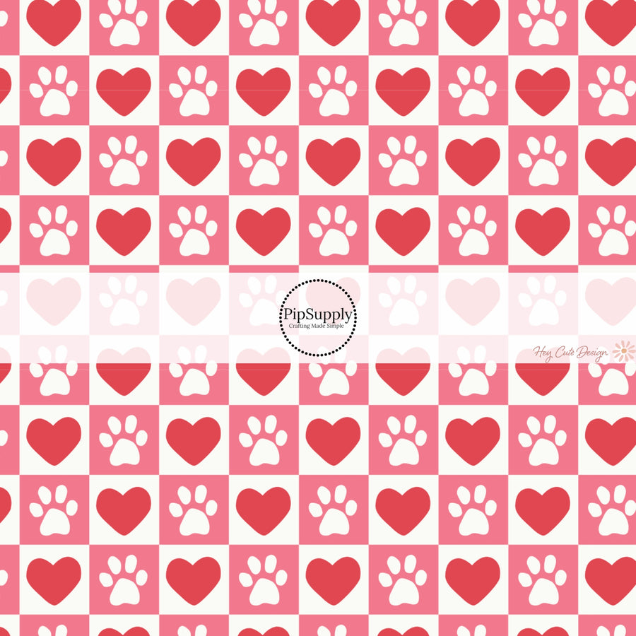 This holiday fabric by the yard features red hearts and dog paws on pink and cream checkers. This festive pattern fabric can be used for all your sewing and crafting needs!