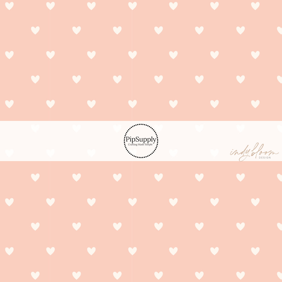 This summer fabric by the yard features tiny cream hearts on light peach. This fun summer themed fabric can be used for all your sewing and crafting needs!