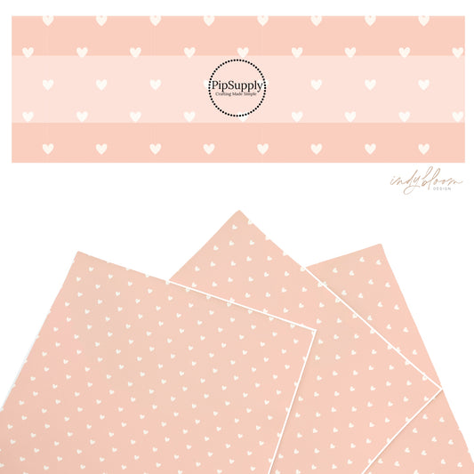 These summer faux leather sheets contain the following design elements: tiny cream hearts on light peach. Our CPSIA compliant faux leather sheets or rolls can be used for all types of crafting projects.