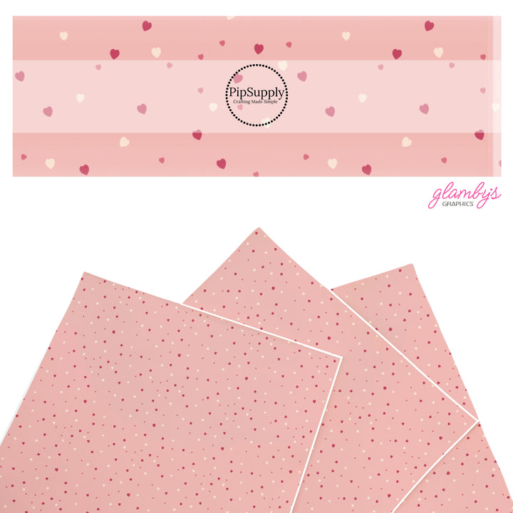 These holiday faux leather sheets contain the following design elements: tiny hearts on peach. Our CPSIA compliant faux leather sheets or rolls can be used for all types of crafting projects.