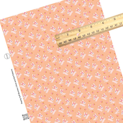 These spring pattern themed faux leather sheets contain the following design elements: pink tulips surrounding cream bunnies on peach. Our CPSIA compliant faux leather sheets or rolls can be used for all types of crafting projects.