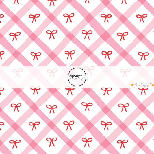 These winter bow themed pattern fabric by the yard features the following design elements: red bows on pink and cream grid pattern. This fun themed fabric can be used for all your sewing and crafting needs!