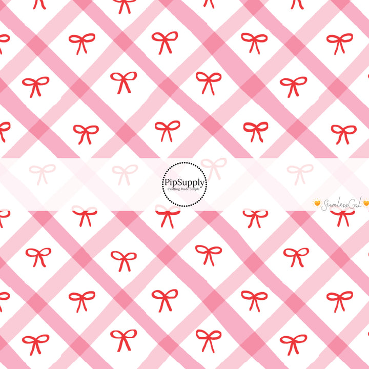 These winter bow themed pattern fabric by the yard features the following design elements: red bows on pink and cream grid pattern. This fun themed fabric can be used for all your sewing and crafting needs!