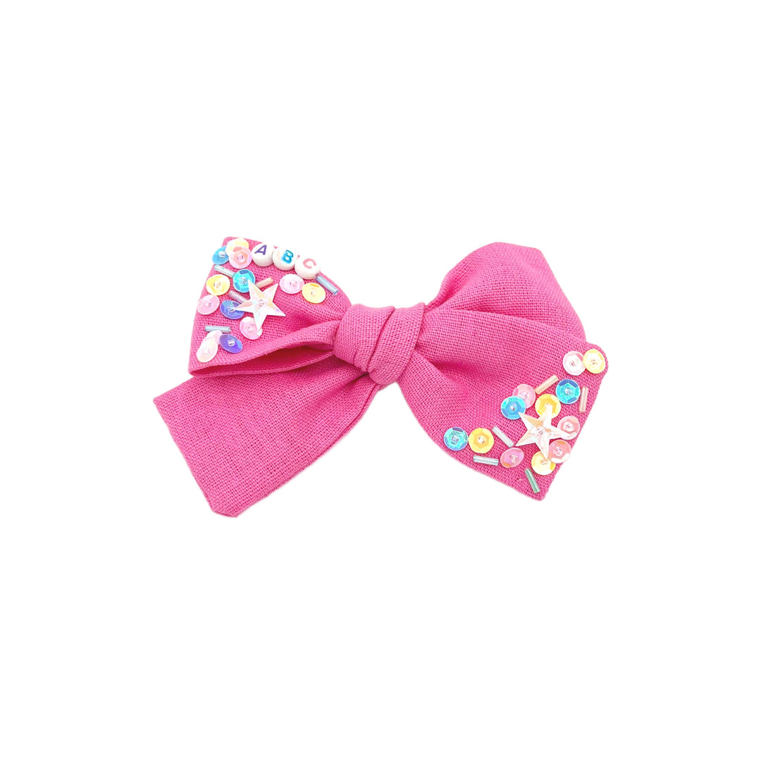 These school themed linen pre-cut tied bows are ready to package and resell to your customers no sewing or measuring necessary! These hair bows come with a clip already attached. The linen hair bow has fun embellishments.