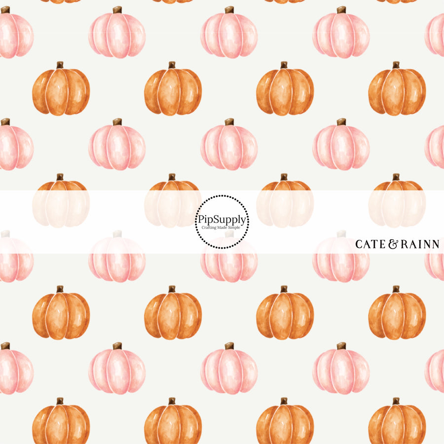 These Halloween themed cream fabric by the yard features orange and light pink pumpkins on ivory. This fun spooky themed fabric can be used for all your sewing and crafting needs! 