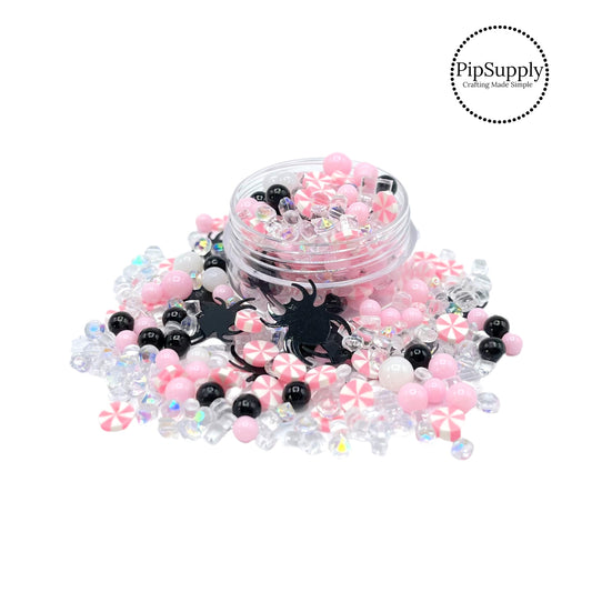 Black spiders, pink beads, rhinestones, and candy clay slice mix