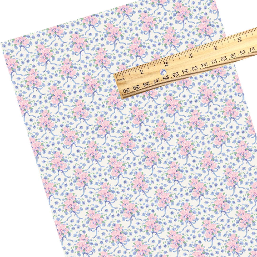 These spring floral themed faux leather sheets contain the following design elements: blue and pink flowers with blue bows. Our CPSIA compliant faux leather sheets or rolls can be used for all types of crafting projects.