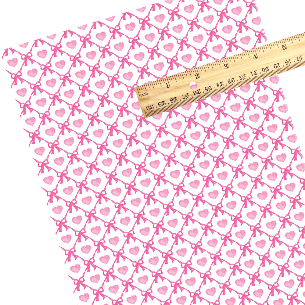 These holiday faux leather sheets contain the following design elements: pink hearts between pink bow lattice. Our CPSIA compliant faux leather sheets or rolls can be used for all types of crafting projects.