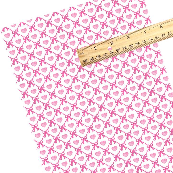 These holiday faux leather sheets contain the following design elements: pink hearts between pink bow lattice. Our CPSIA compliant faux leather sheets or rolls can be used for all types of crafting projects.