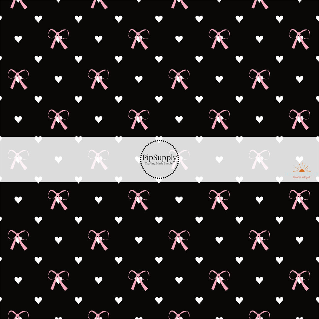 This holiday fabric by the yard features pink bows and white hearts on black. This festive pattern fabric can be used for all your sewing and crafting needs!