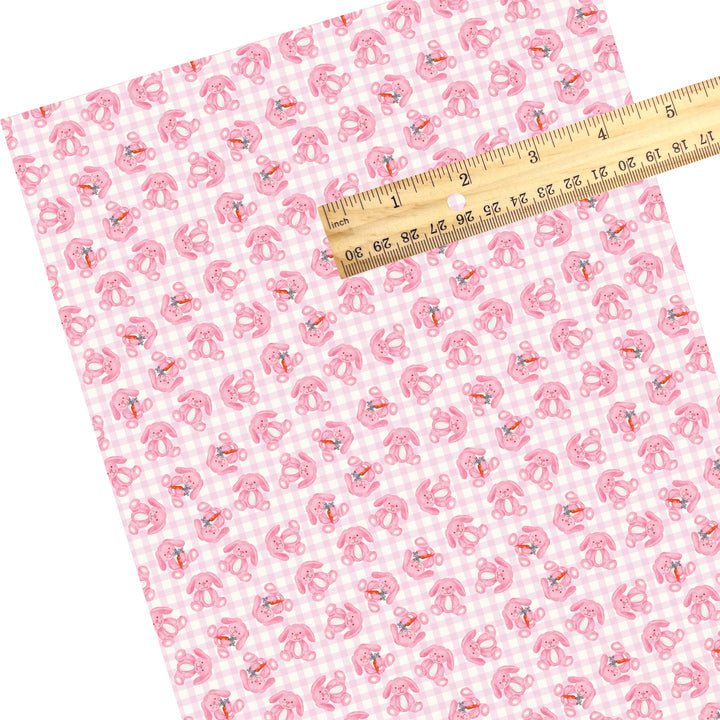 These Easter themed faux leather sheets contain the following design elements: pink bunnies on a light pink gingham pattern. Our CPSIA compliant faux leather sheets or rolls can be used for all types of crafting projects.