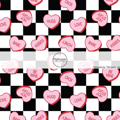 Scattered pink hearts with sayings on black and white checkered hair bow strips