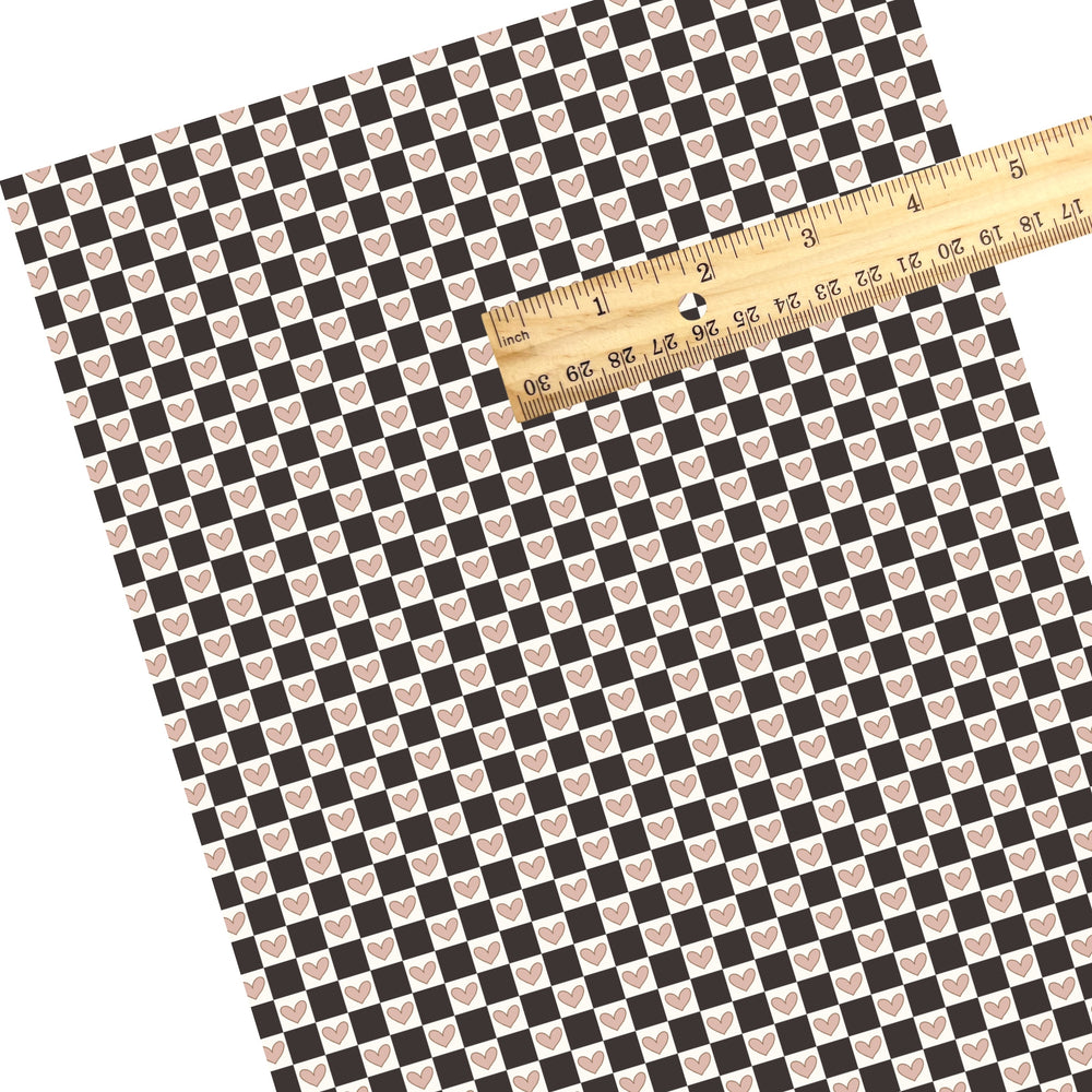 These Valentine's Day themed faux leather sheets contain the following design elements: black checker pattern with light pink hearts. Our CPSIA compliant faux leather sheets or rolls can be used for all types of crafting projects.