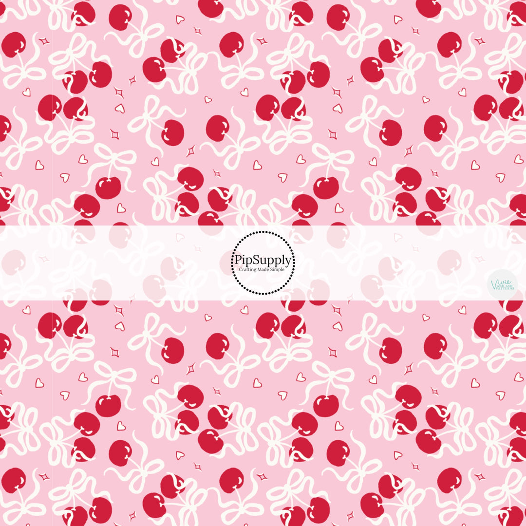 This holiday fabric by the yard features Valentine cherry bows. This festive pattern fabric can be used for all your sewing and crafting needs!