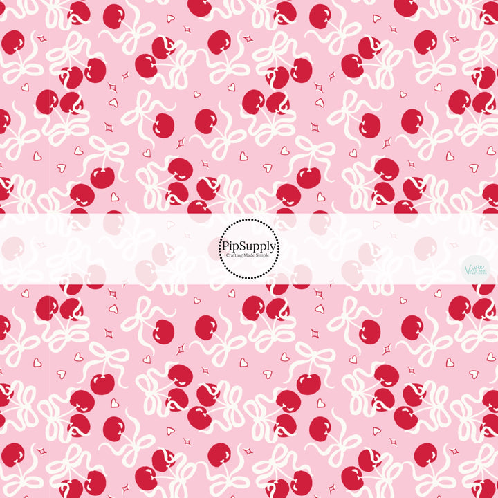 This holiday fabric by the yard features Valentine cherry bows. This festive pattern fabric can be used for all your sewing and crafting needs!