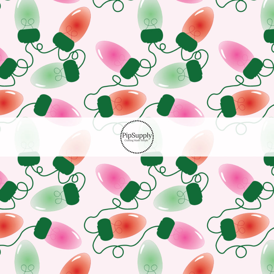 These Christmas themed pattern fabric by the yard features the following design elements: Christmas colorful lights on pink. This fun themed fabric can be used for all your sewing and crafting needs!