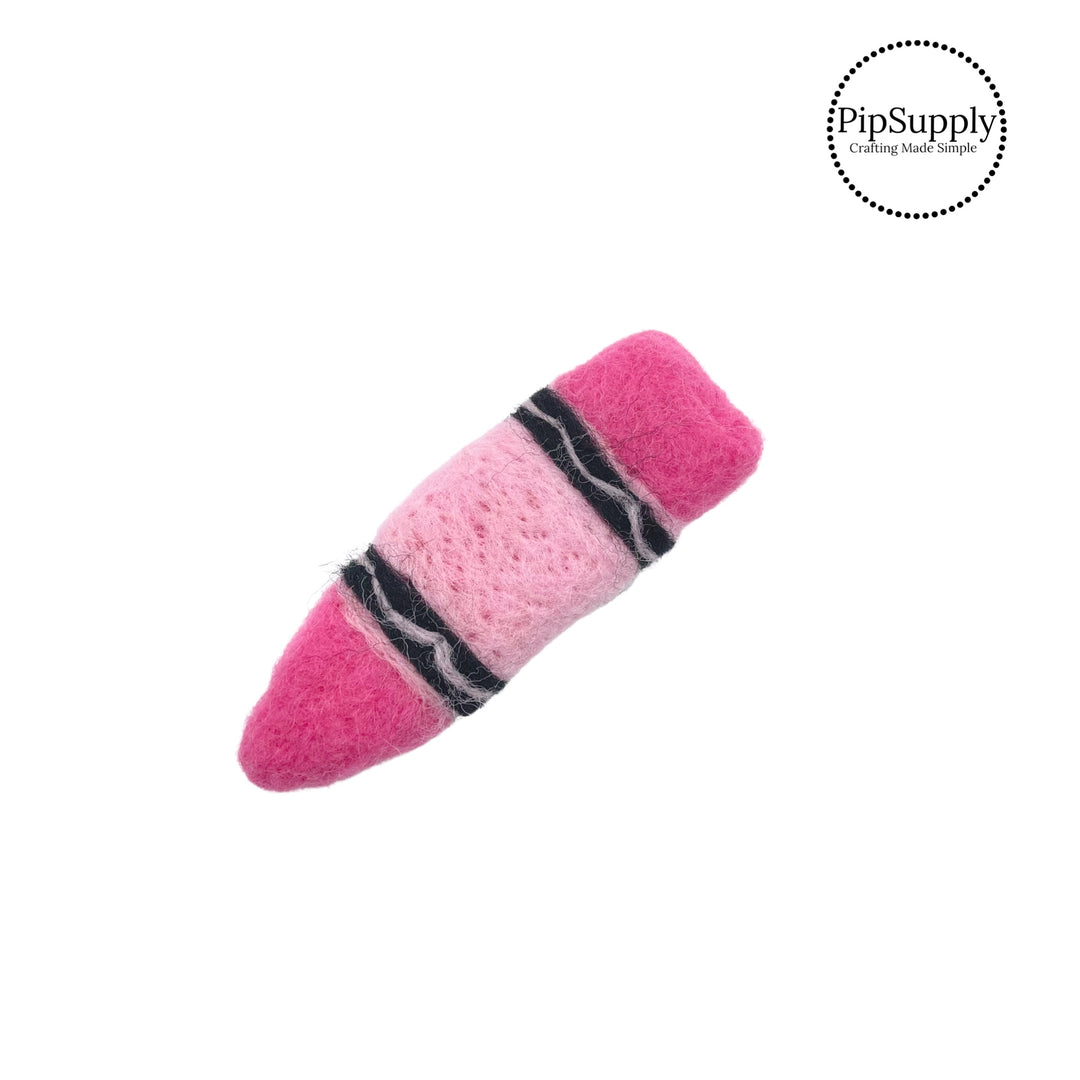 Pink crayon with black lines felt embellishment