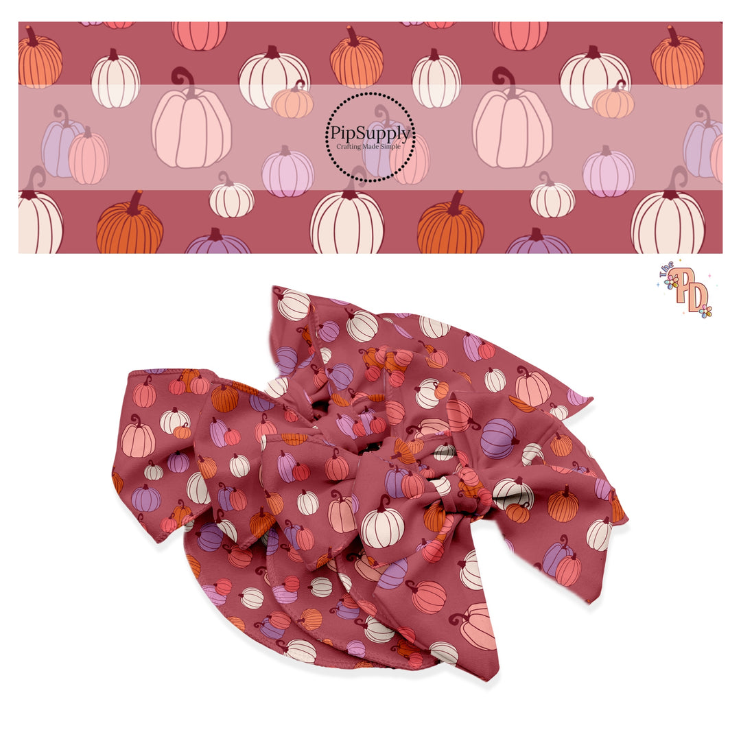 Cream, pink, orange, and purple pumpkins on mauve hair bow strips