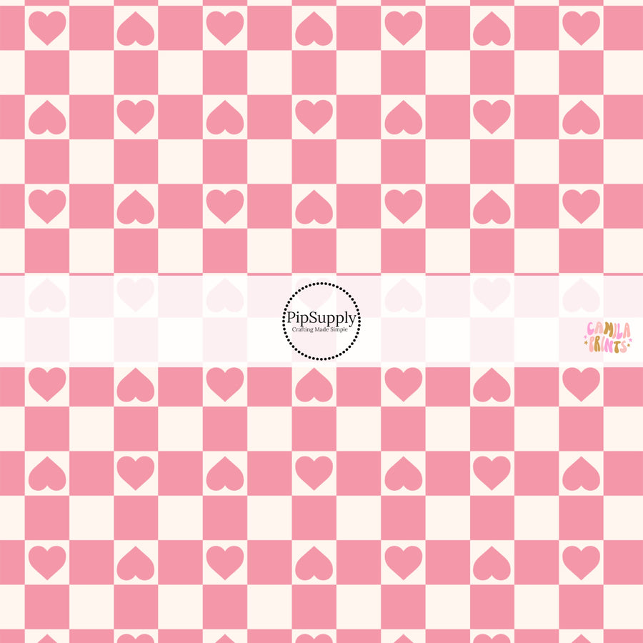 This holiday fabric by the yard features hearts on pink and cream checkers. This festive pattern fabric can be used for all your sewing and crafting needs!