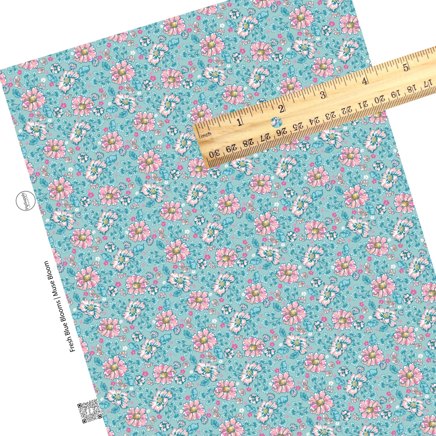 These floral themed blue faux leather sheets contain the following design elements: hot pink, light pink, and aqua flowers on blue. 