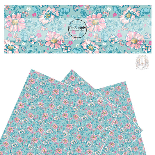 These floral themed blue faux leather sheets contain the following design elements: hot pink, light pink, and aqua flowers on blue. 