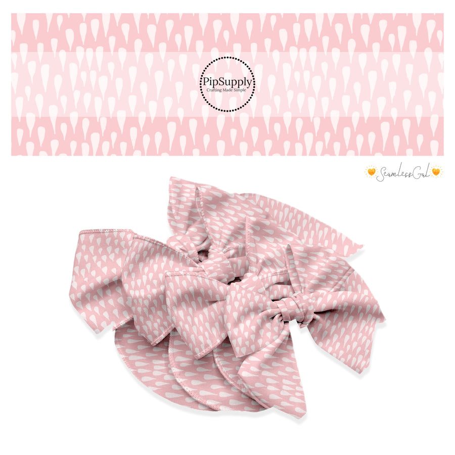 These spring no sew bow strips can be easily tied and attached to a clip for a finished hair bow. These fun bow strips are great for personal use or to sell. These bow strips feature the following design elements: drops on light pink.