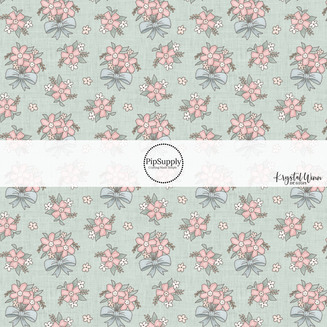 This fun fabric by the yard features pink flower bundles with blue bows. This fun pattern fabric can be used for all your sewing and crafting needs!