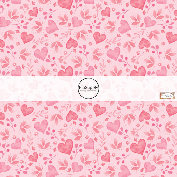 This holiday fabric by the yard features pink hearts and floral pattern. This festive pattern fabric can be used for all your sewing and crafting needs!