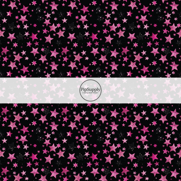 This holiday fabric by the yard features pink stars on black. This festive pattern fabric can be used for all your sewing and crafting needs!