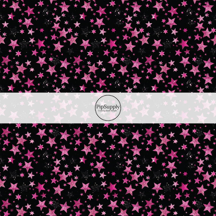 This holiday fabric by the yard features pink stars on black. This festive pattern fabric can be used for all your sewing and crafting needs!