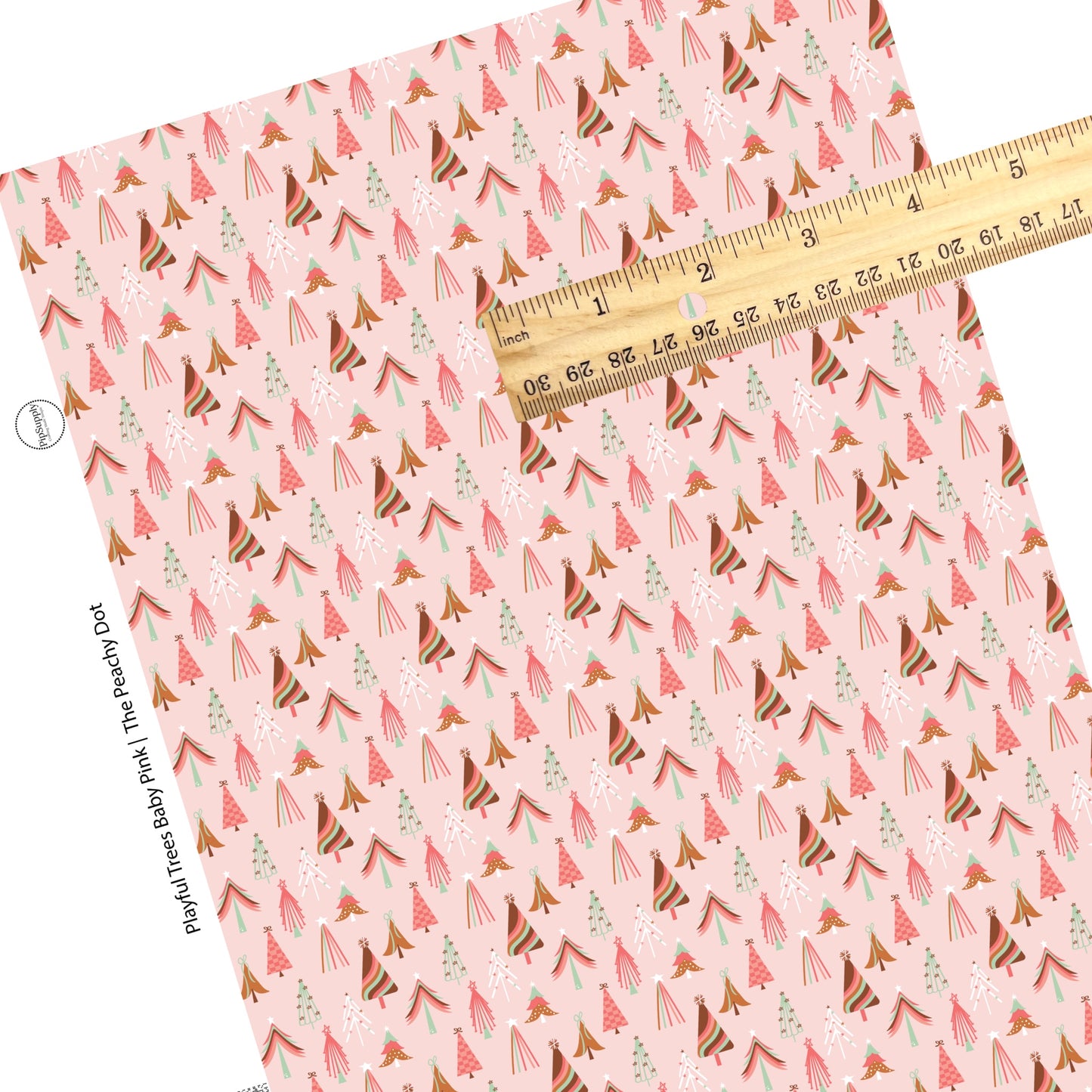 Pink and green multi christmas trees on pink faux leather sheets