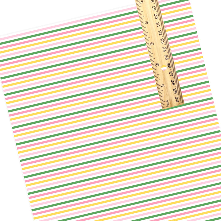 These summer faux leather sheets contain the following design elements: pink, yellow, white, and green stripe pattern. Our CPSIA compliant faux leather sheets or rolls can be used for all types of crafting projects.