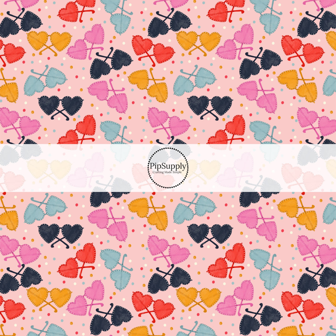 This holiday fabric by the yard features colorful heart glasses. This festive pattern fabric can be used for all your sewing and crafting needs!