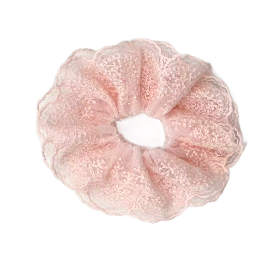 These lace ruffled scrunchies are a beautiful accessory to add to any look or hair style. The scrunchie has an elastic band sewn inside for stretch-ability.