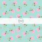 This summer fabric by the yard features pink roses on aqua. This fun summer themed fabric can be used for all your sewing and crafting needs!