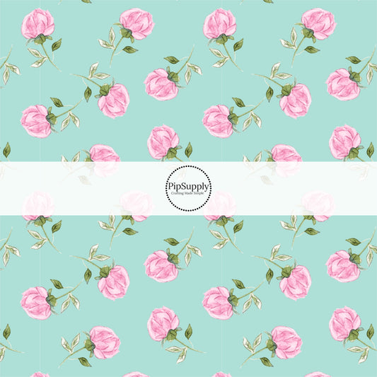This summer fabric by the yard features pink roses on aqua. This fun summer themed fabric can be used for all your sewing and crafting needs!