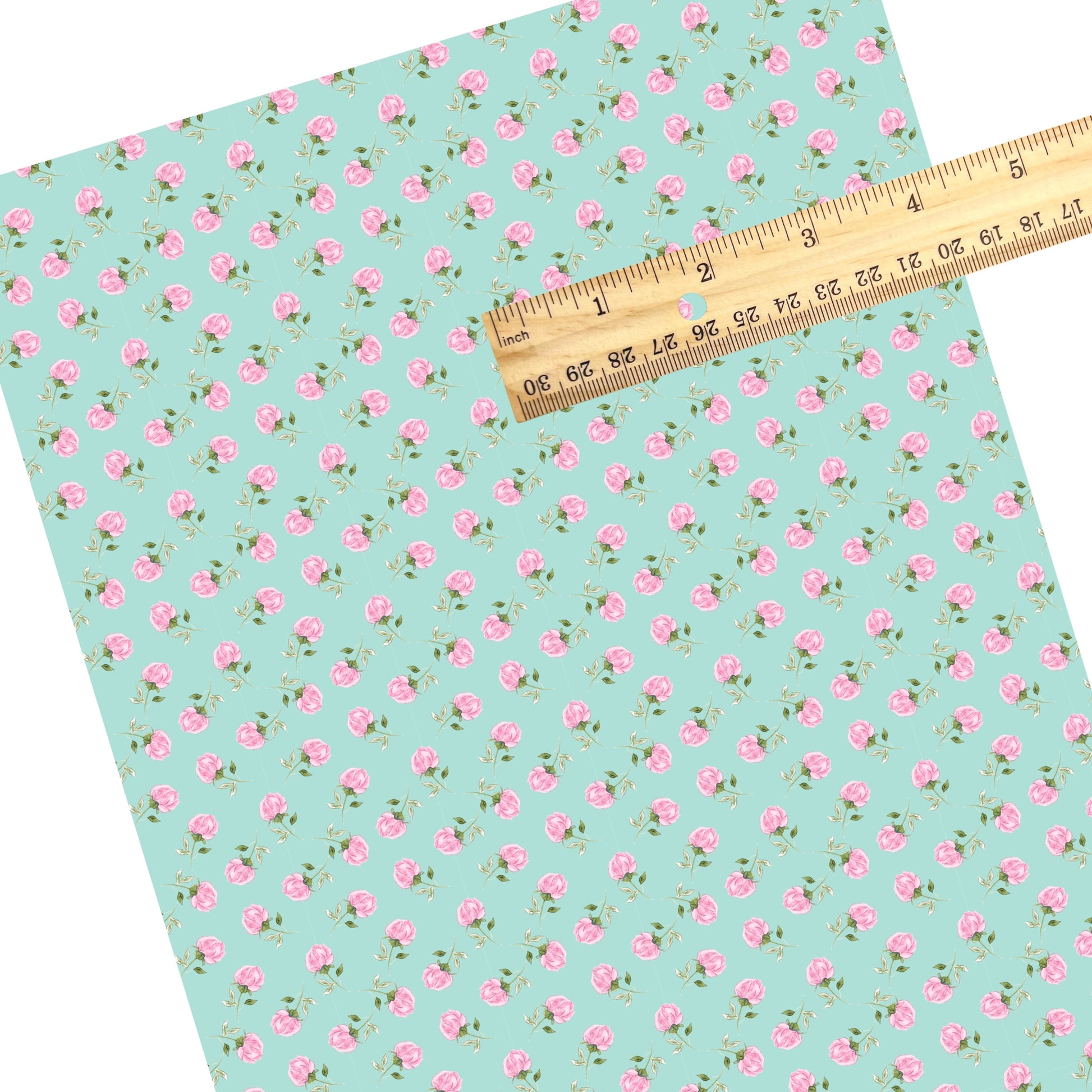 These summer faux leather sheets contain the following design elements: pink roses on aqua. Our CPSIA compliant faux leather sheets or rolls can be used for all types of crafting projects.