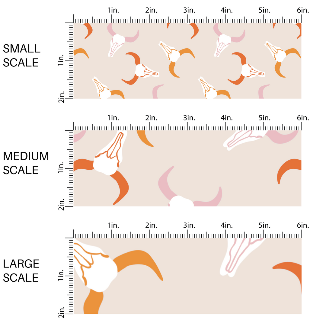 This chart shows small scale, medium scale, and large scale of western themed pink and orange longhorns fabric by the yard. 